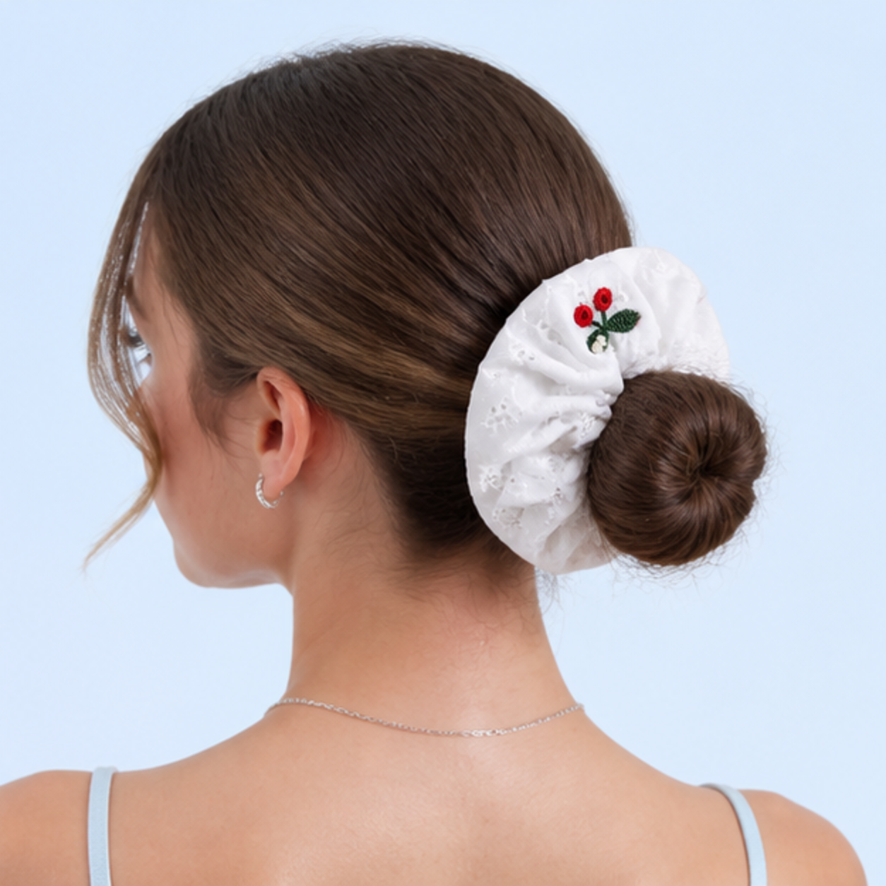 LUSTREPOP cherry scrunchie styled on a pale blue background
