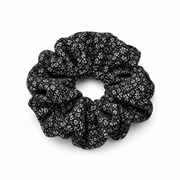 Black & White Ditsy Floral Scrunchie on a pure white background with a natural product shadow