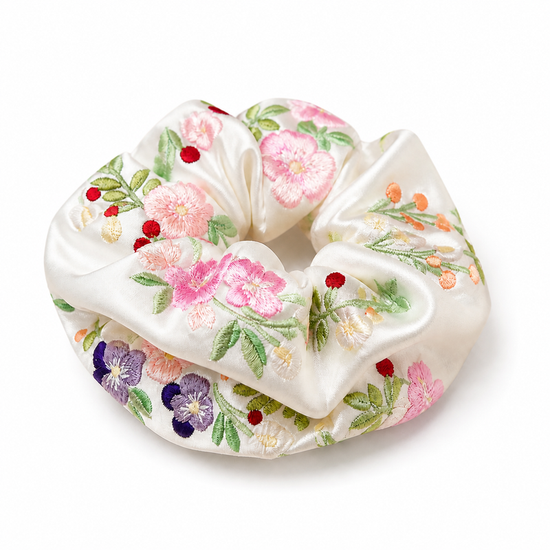 Embroidered Floral Satin Scrunchie on a pure white background with a natural product shadow