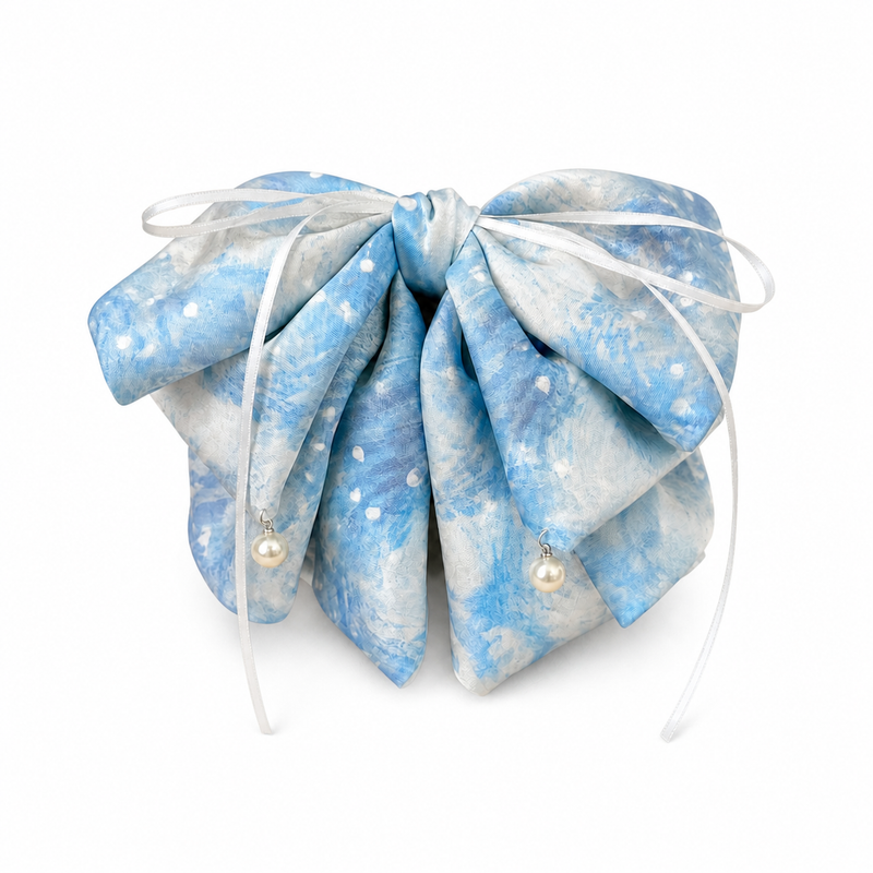 Polka-Dot Ribbon Ponytail Clip on a pure white background with a natural product shadow
