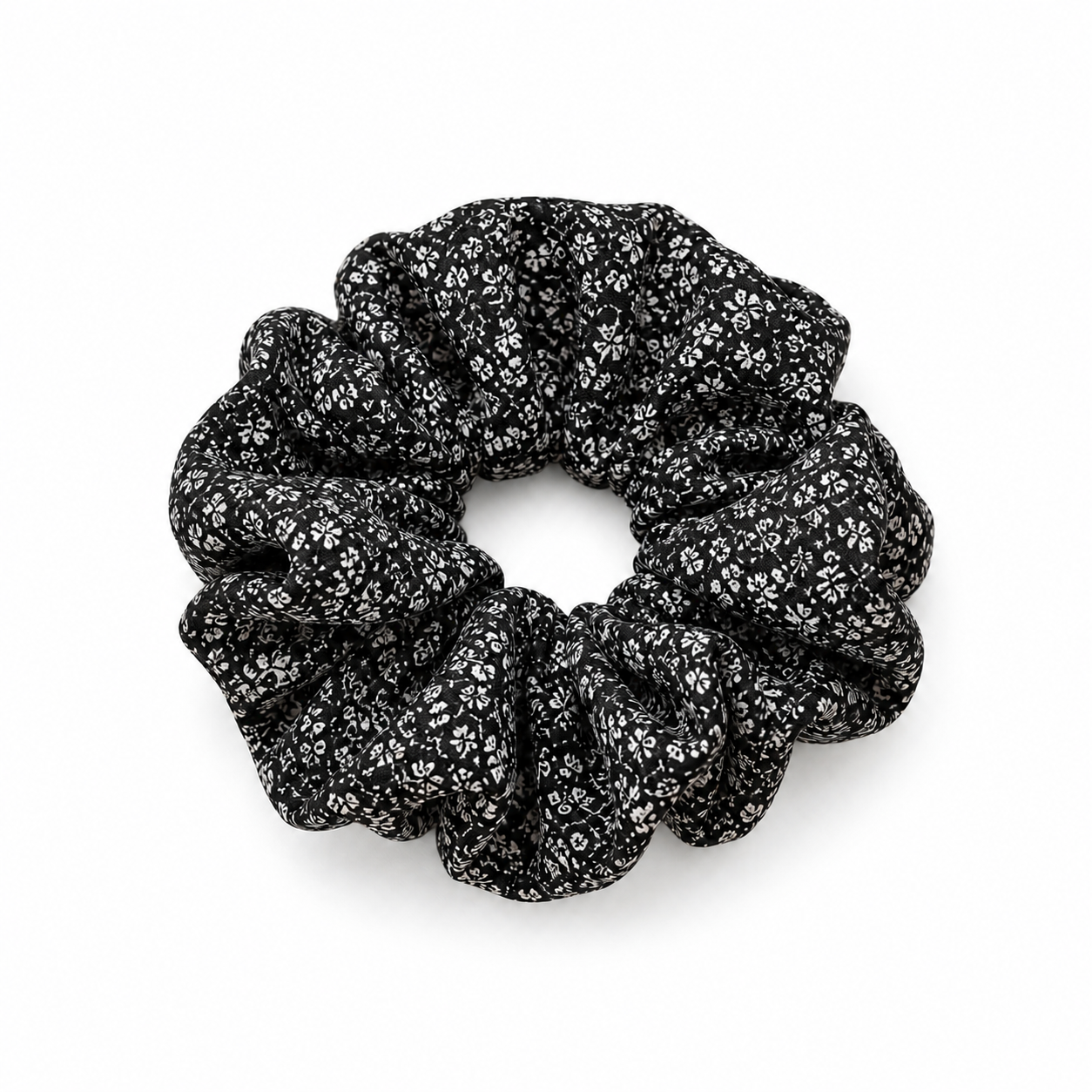 Black & White Ditsy Floral Scrunchie on a white background